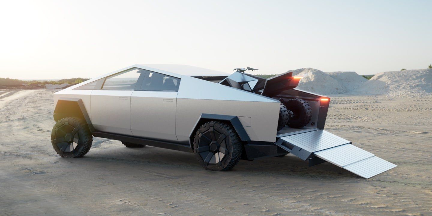 Silver futuristic pickup truck with rear ramp open in a desert landscape