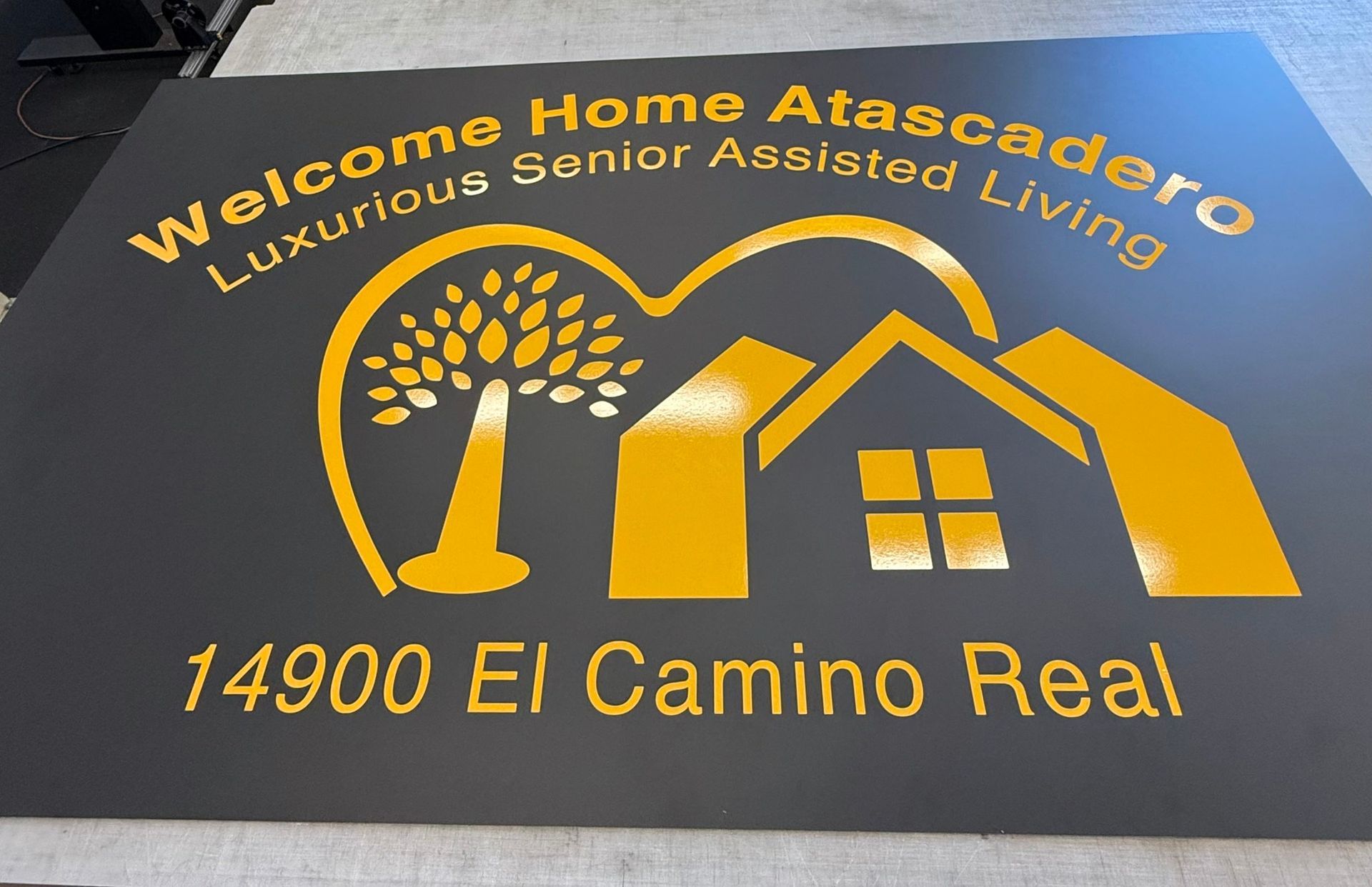 Welcome Home Atascadero luxury senior assisted living sign with house and tree, 14900 El Camino Real