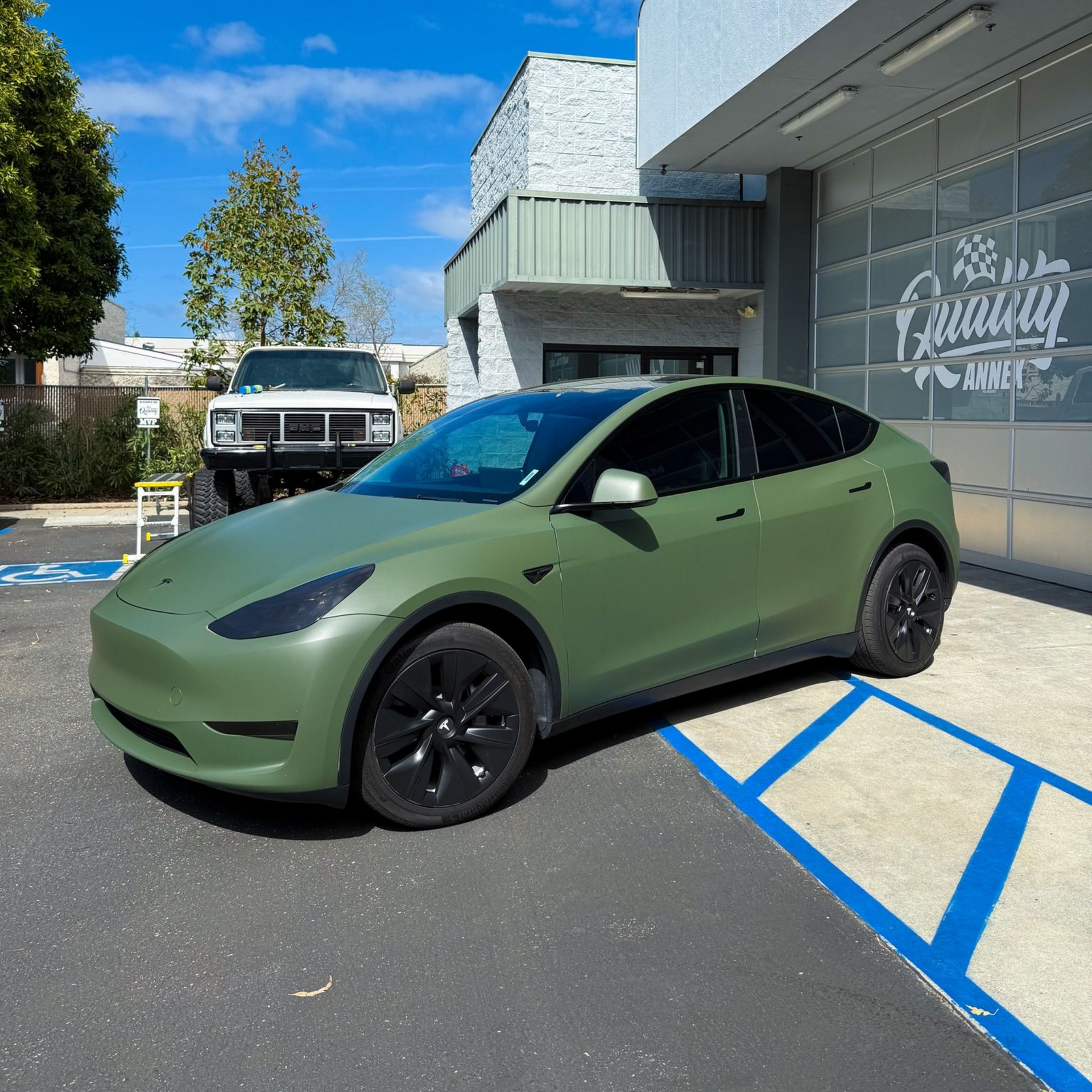 Matte green Tesla Model Y custom vinyl wrap by Quality Tinting & Signs in San Luis Obispo