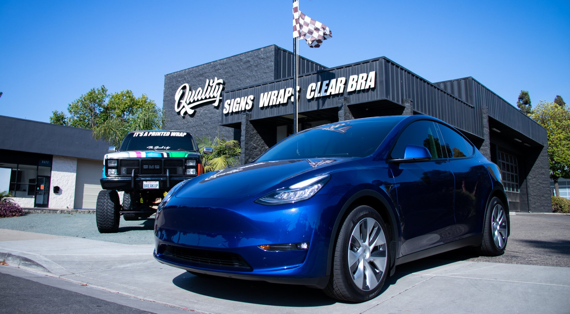 Blue Tesla Model Y window tinting customer at Quality Tinting & Signs in San Luis Obispo