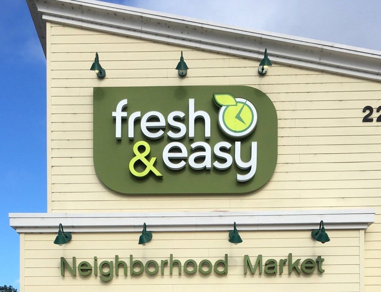 Fresh & Easy Neighborhood Market storefront sign on a beige building