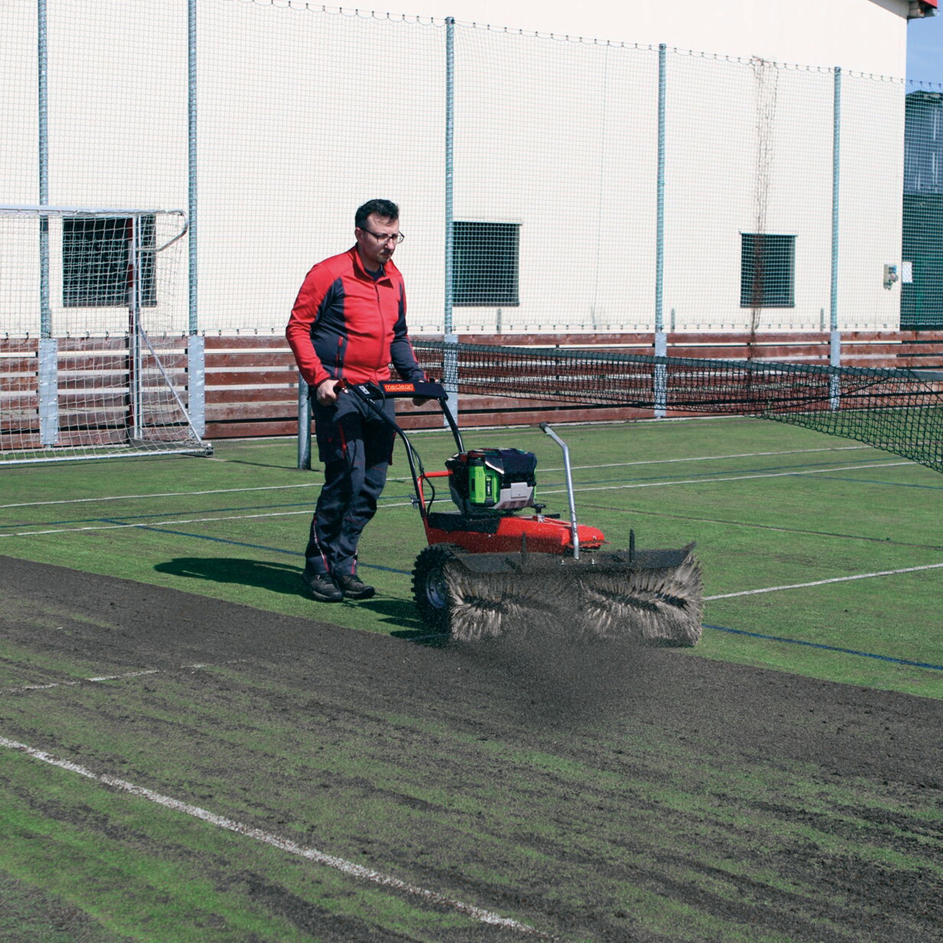 Meclean Frontsweep Pro sweeping on sporting field