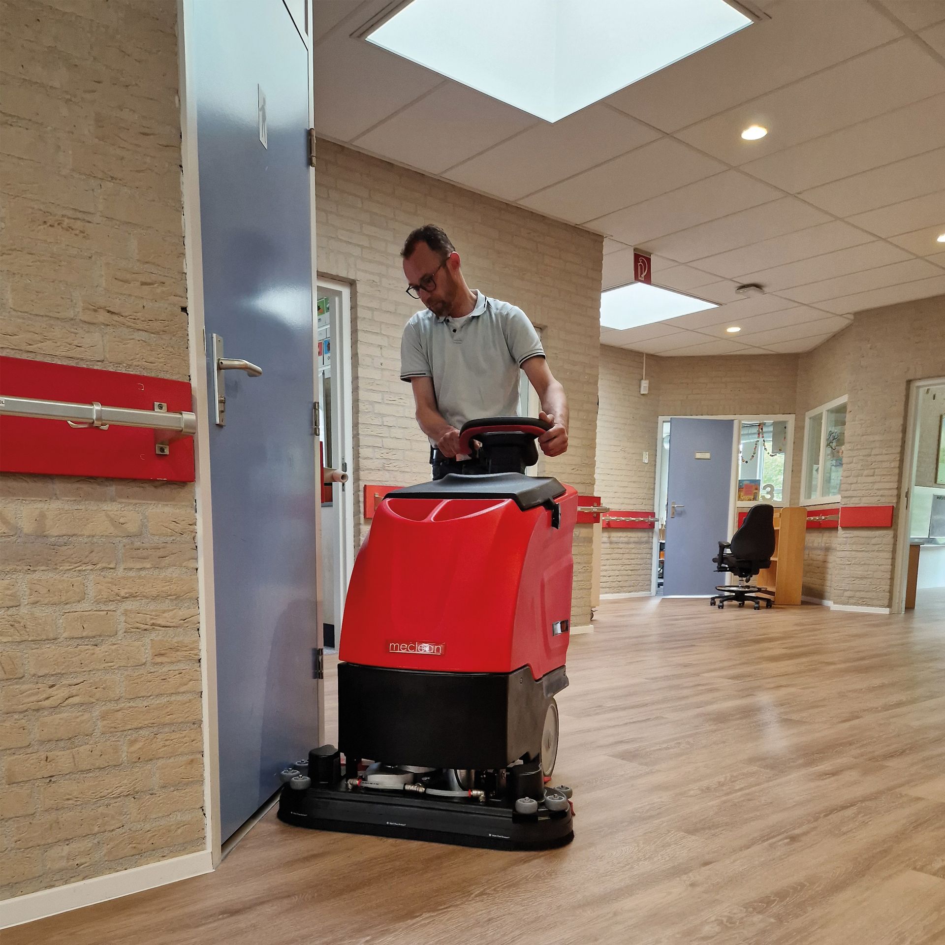 Meclean walk-behind scrubber-dryer POWERSCRUB 70.20D on wood floor