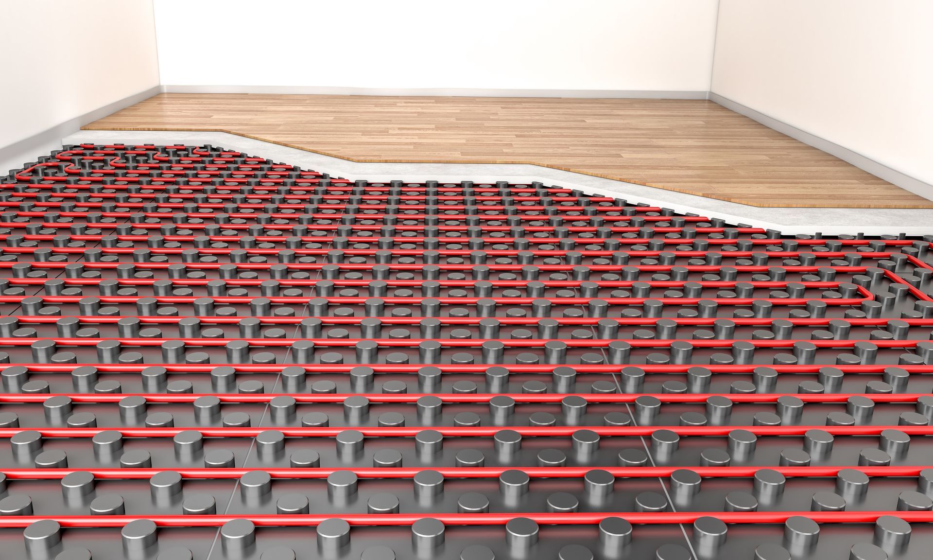 A room with a wooden floor and a red and black underfloor heating system.