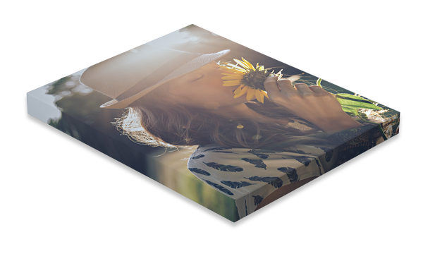 Brushed metal plaque with a sunflower and large white text on a reflective background
