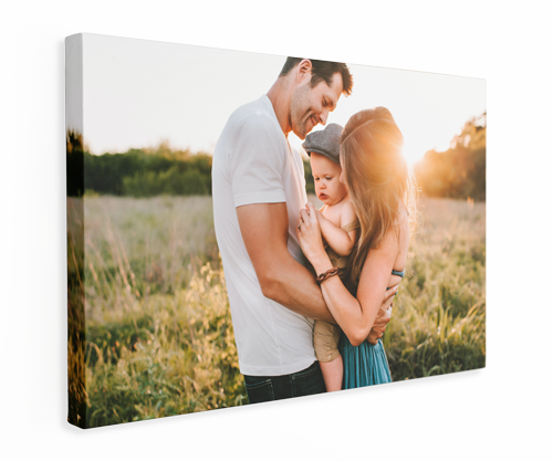 Family hugging in a sunlit field, printed on a white canvas