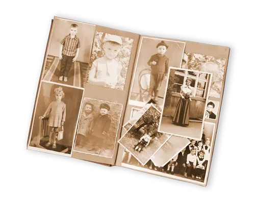 Open vintage photo album with several sepia-toned portrait and family snapshots