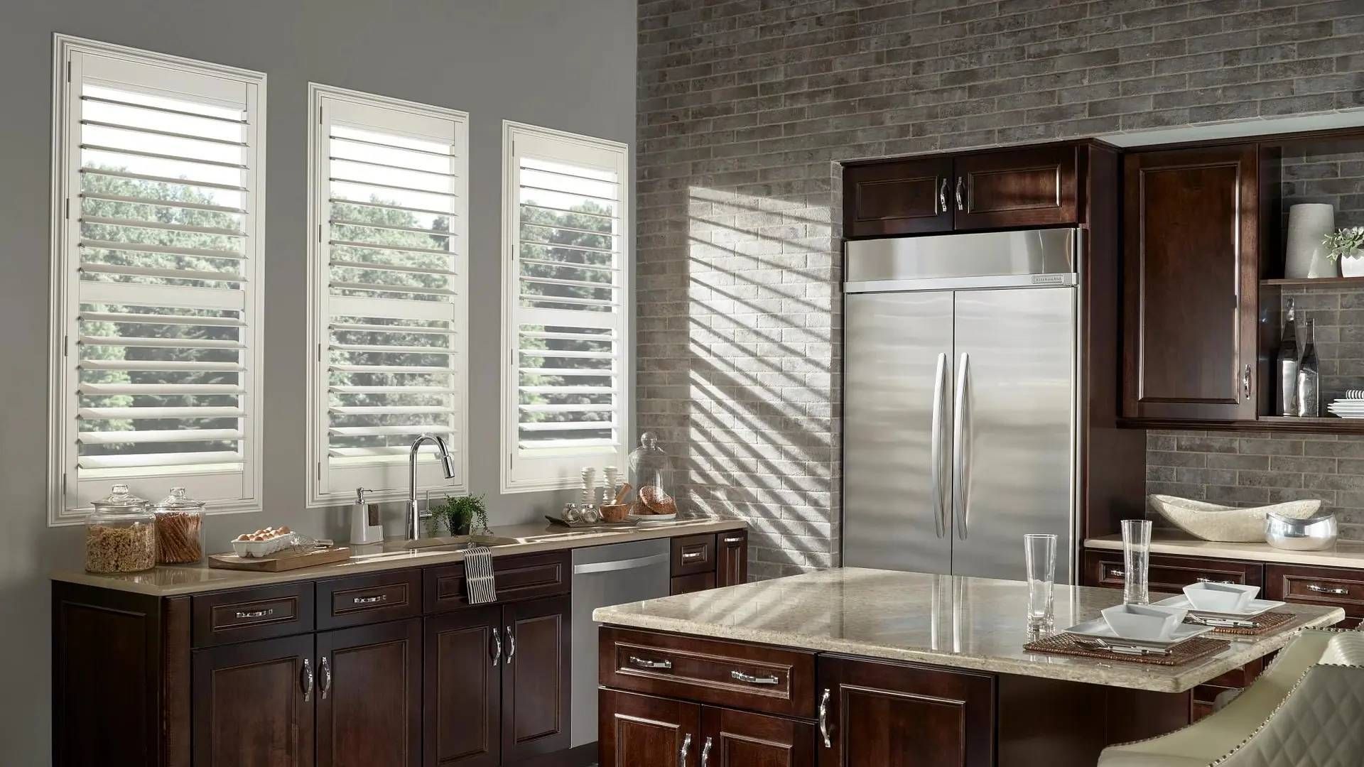 Alta Polyresin Shutters on three windows in a sleek and modern kitchen