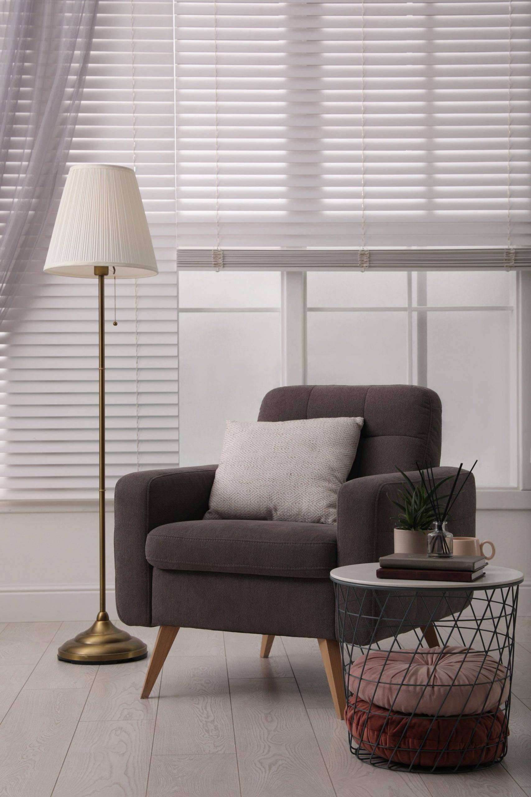CACO Avalon Faux Wood Blinds on windows in a chic living room