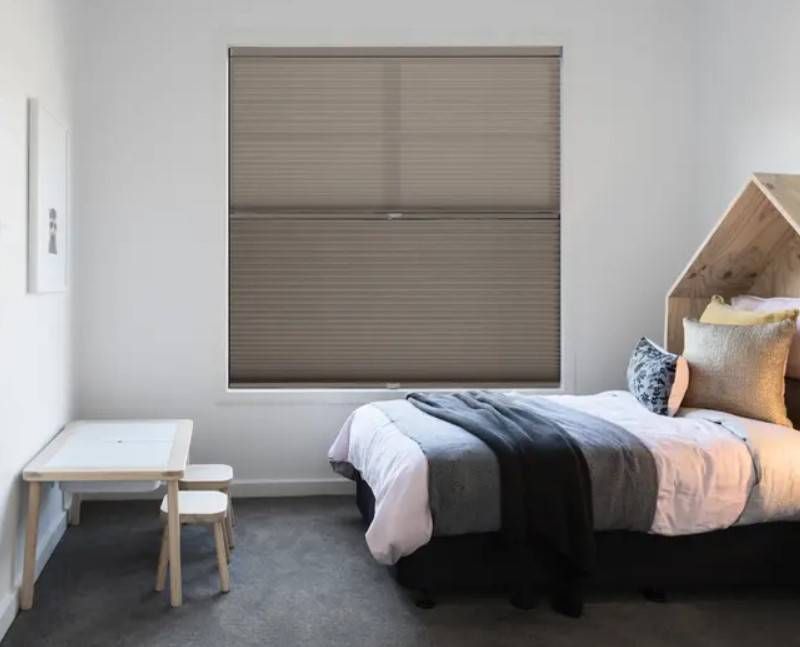 CACO Boone Collection Cellular Shades fully closed on a window in a child's bedroom
