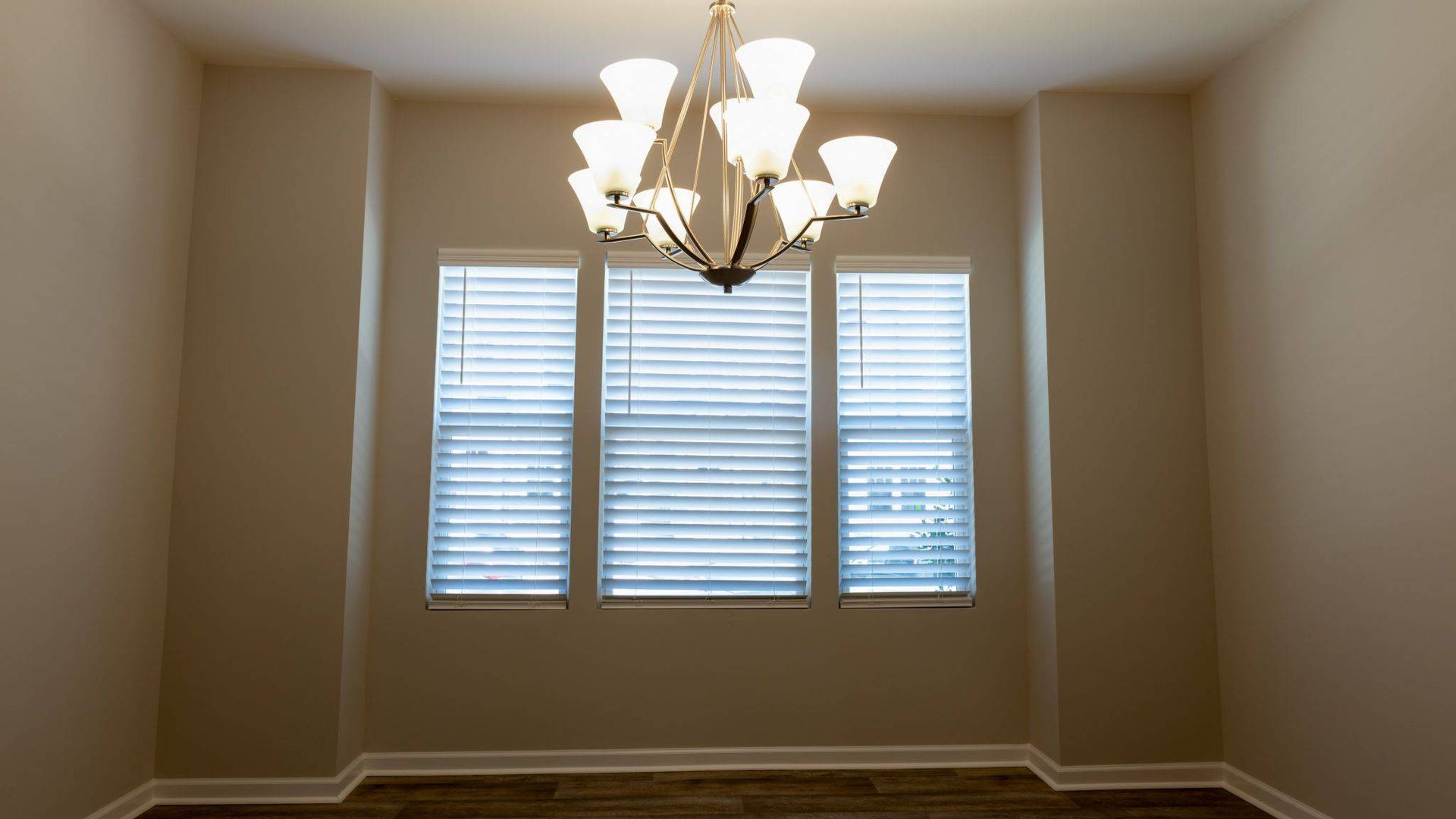 CACO Cordless Fast Faux Blinds after being installed on windows in a dining room