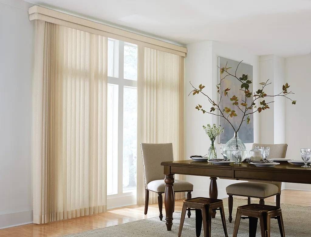Graber® Vertical Blinds in a split stacking style on a sliding door in a dining room