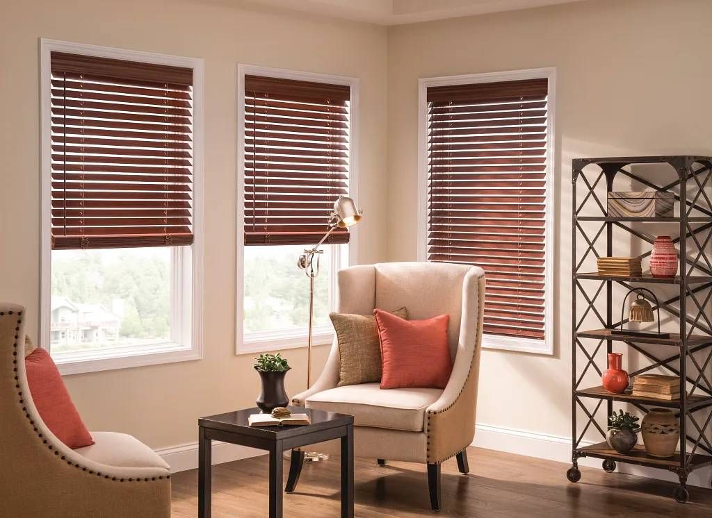 Graber® Wood Blinds on three windows in a cozy living room