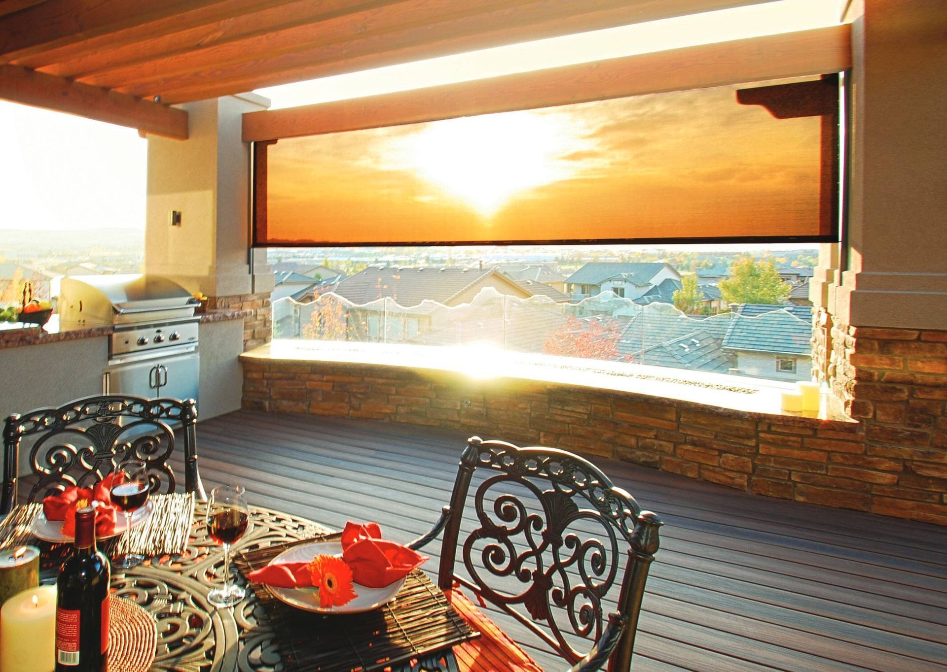 Insolroll Oasis® 2800 Patio Shades on a home with a gorgeous sunset through the shades