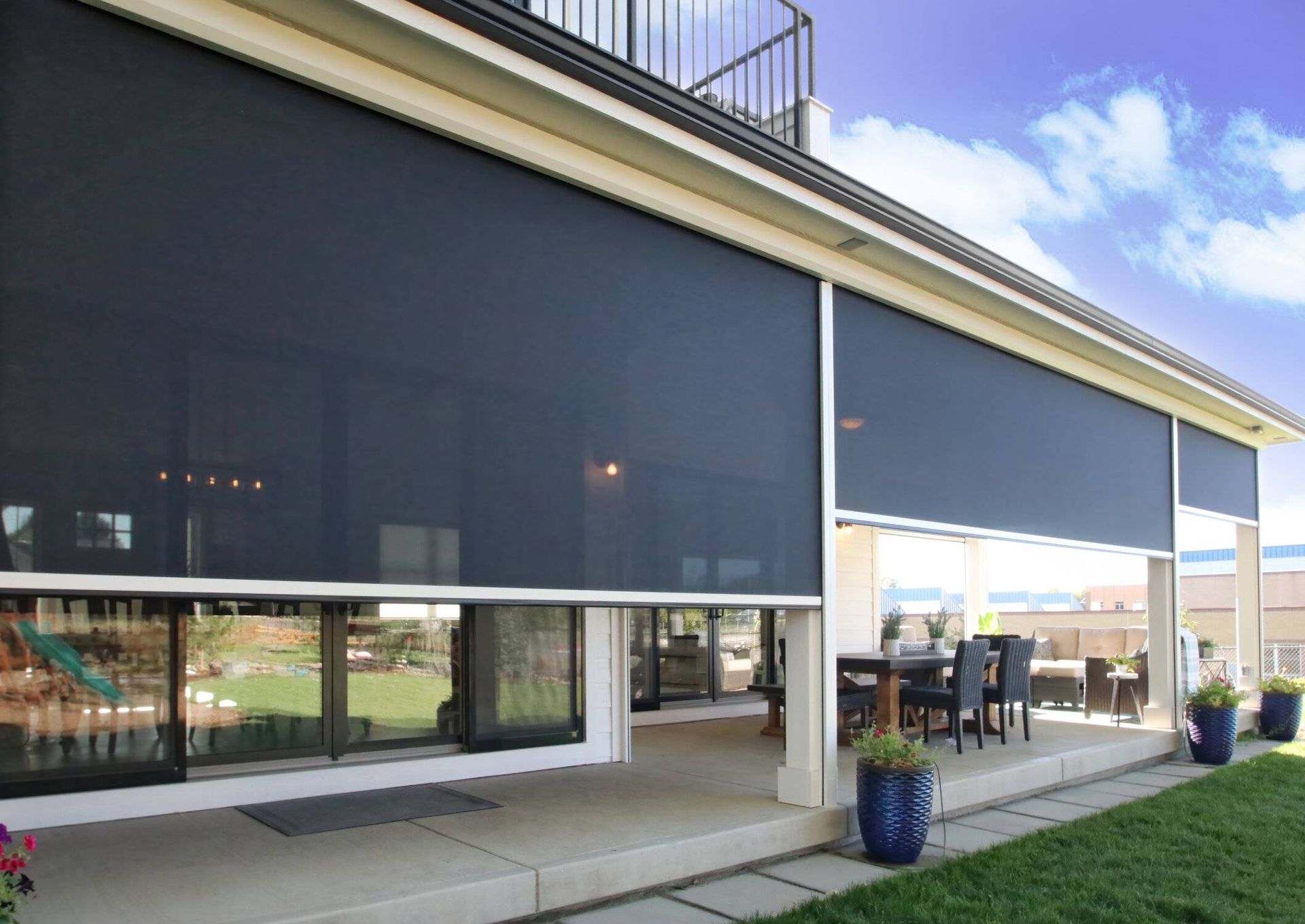 Insolroll Oasis® 2900 Patio Insect Shades on a home's exterior to block pesky bugs