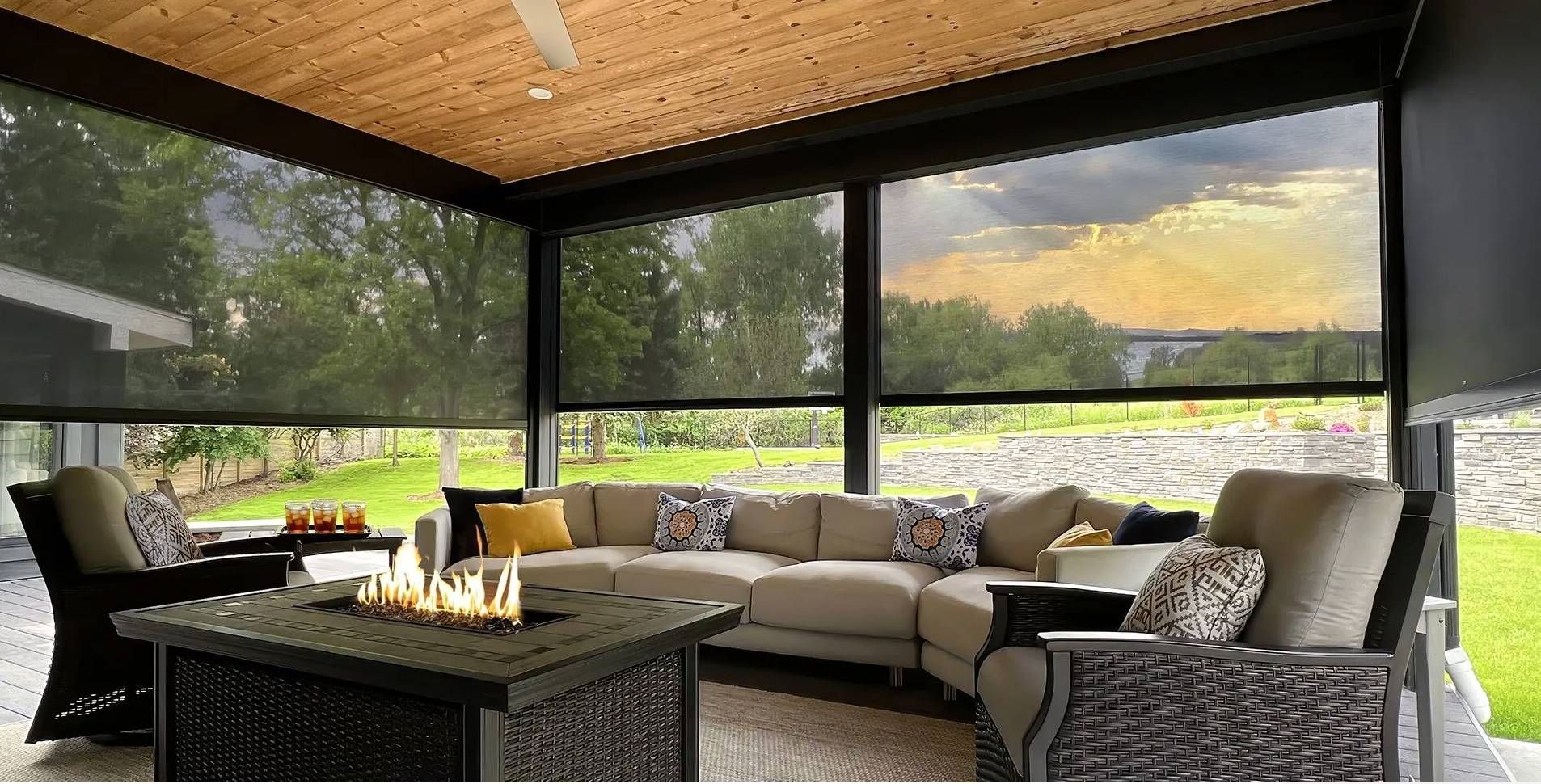 Insolroll Oasis® 2950 Tension Zipper Patio Shades on a home overlooking a beautiful sunset