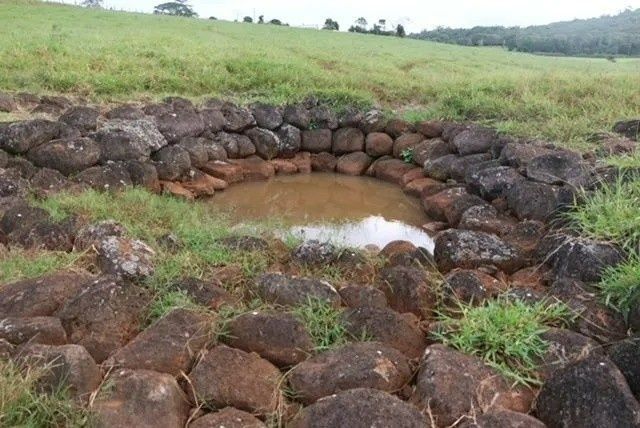 Stone Lined Well Filled with Brown Water — Macca's Dynamic Earthworks in Tolga, QLD