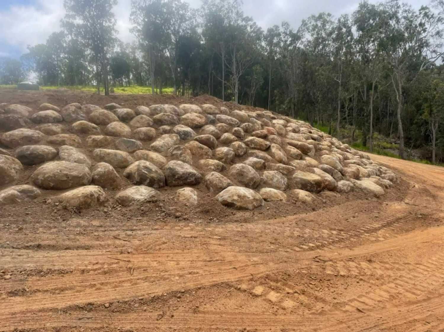 Earthen Hill with Large Rounded Rocks — Macca's Dynamic Earthworks in Tolga, QLD