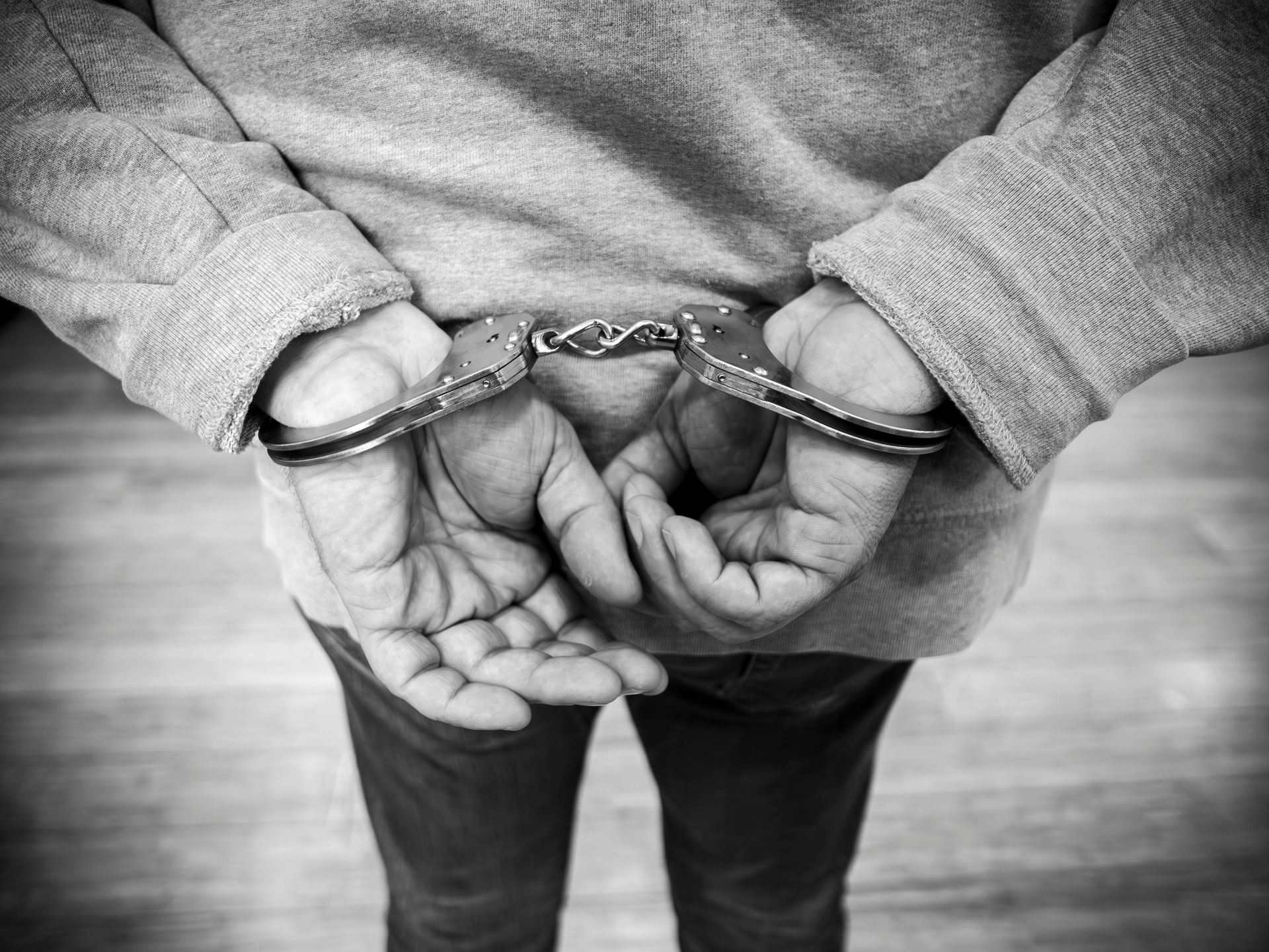 Man With Hands in Cuffs
