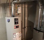 Water heater and metal ducting in a basement utility room