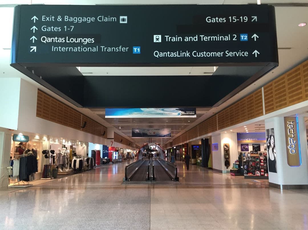 An Empty Airport With a Sign That Says Exit & Baggage Calm — KeyBay in Southern Highlands, NSW