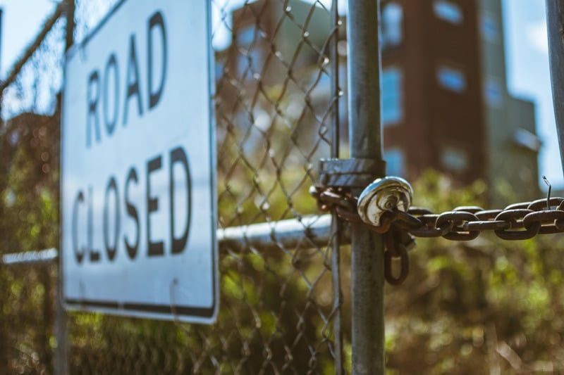 Chain Link Fence With a Road Closed Sign Attached to It — KeyBay in Moss Vale, NSW