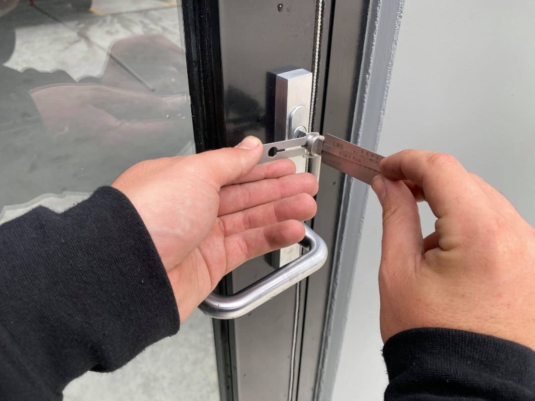 Person is Opening a Door With a Piece of Wood in Their Hand — KeyBay in Mittagong, NSW