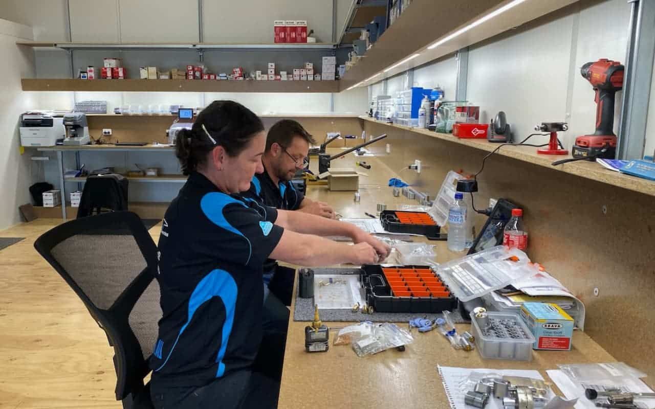 Man and a Woman Are Working on a Computer in a Workshop — KeyBay in Berrima, NSW