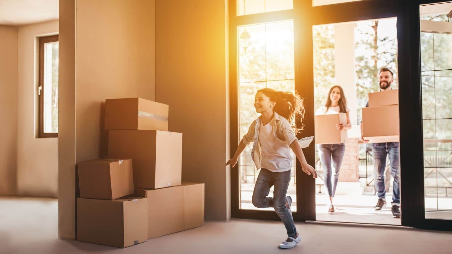 Family is Moving Into a New Home and Carrying Boxes — KeyBay in Mittagong, NSW