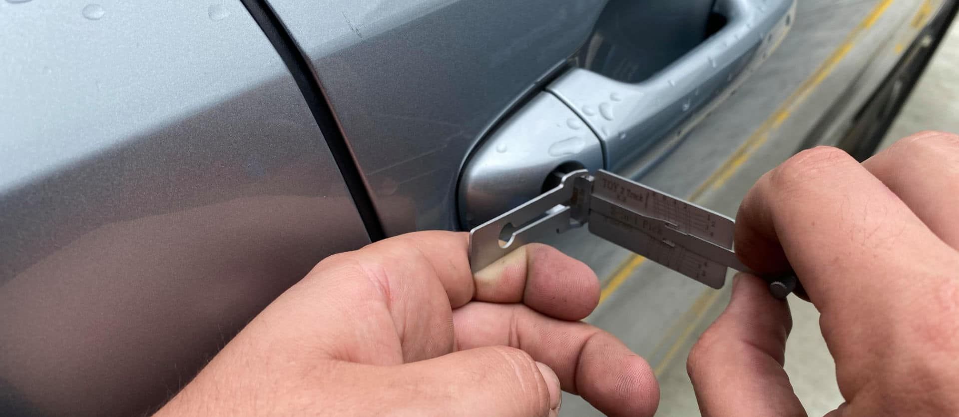 Person is Holding a Key in Front of a Car Door — KeyBay in Narellan, NSW