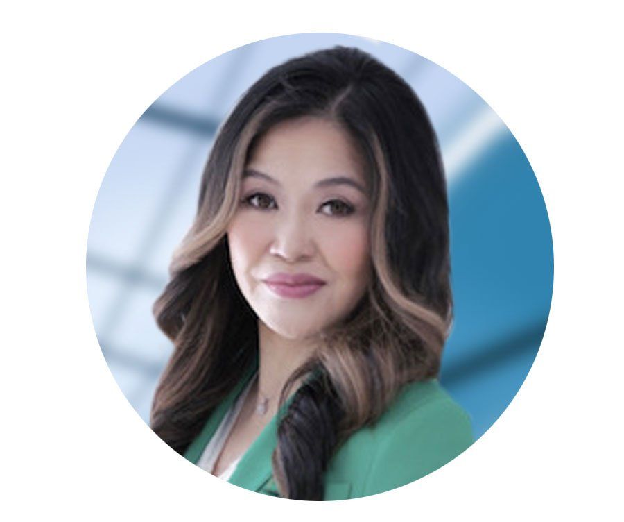 A woman in a green jacket is smiling in a circle