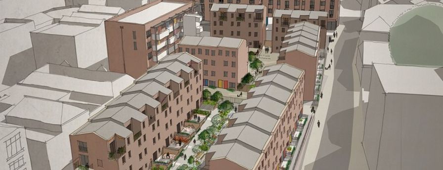 Aerial view of a dense residential complex with tan apartment buildings and a central courtyard.