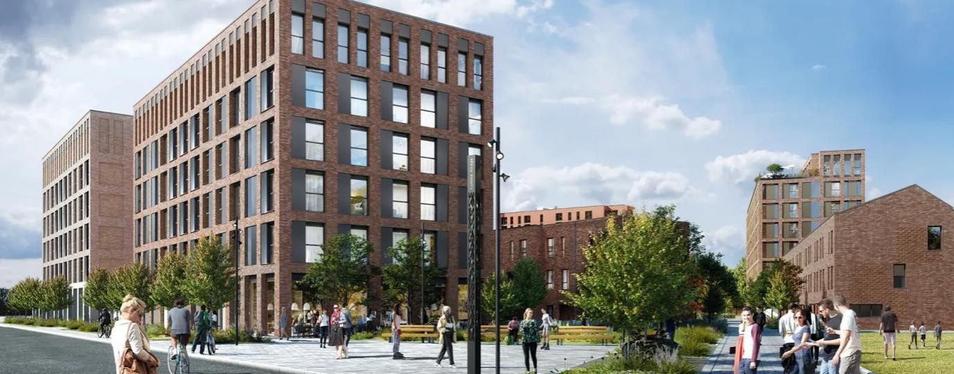 Modern brick apartment buildings with people walking along a city street under a cloudy sky