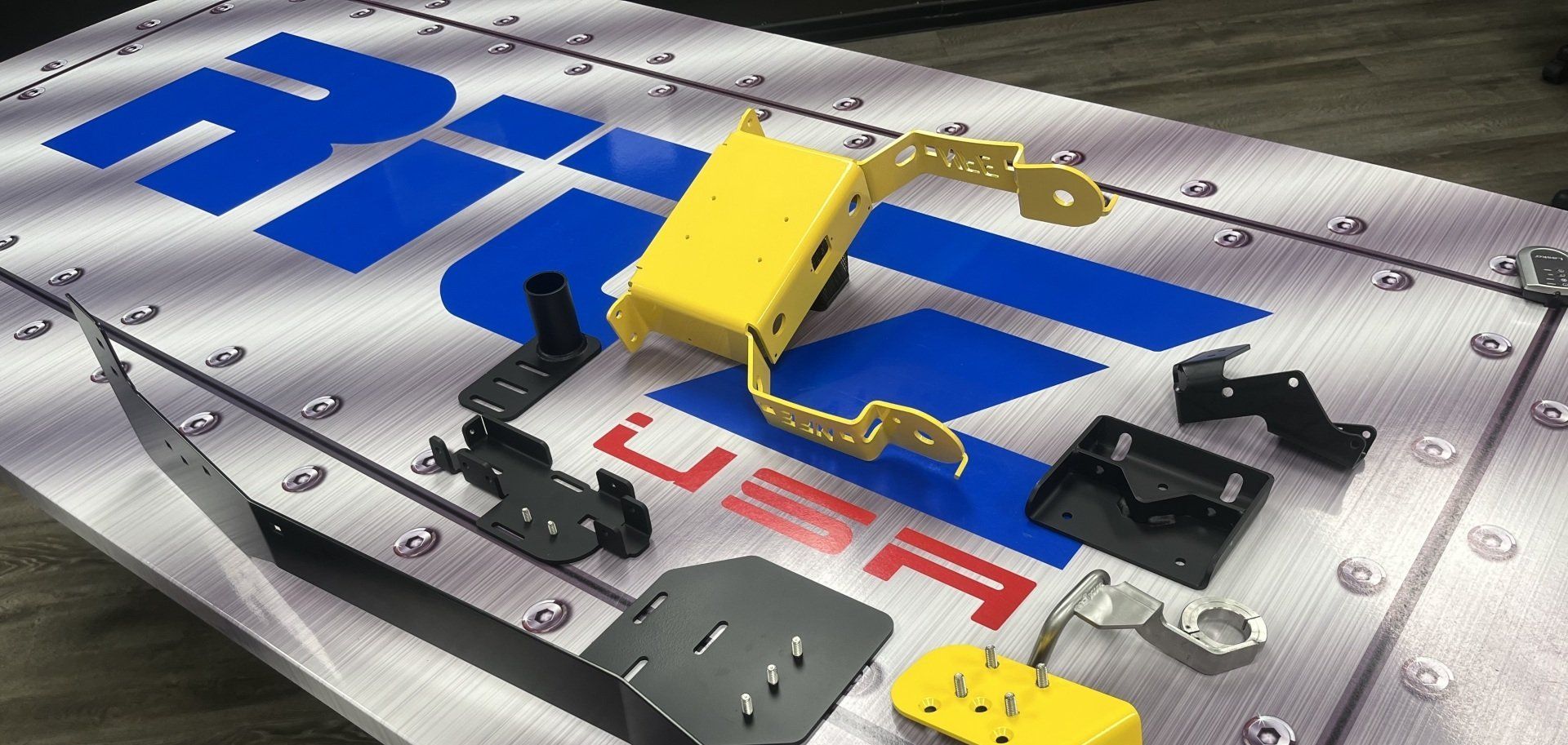 A bunch of pieces of metal are on a table with the word usa on it