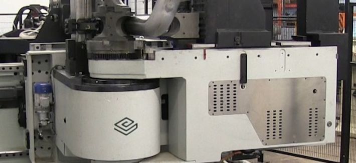 A machine is sitting on top of a table in a factory.