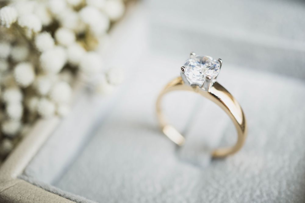 A close up of an engagement ring in a box.