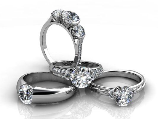 Three rings are stacked on top of each other on a white surface