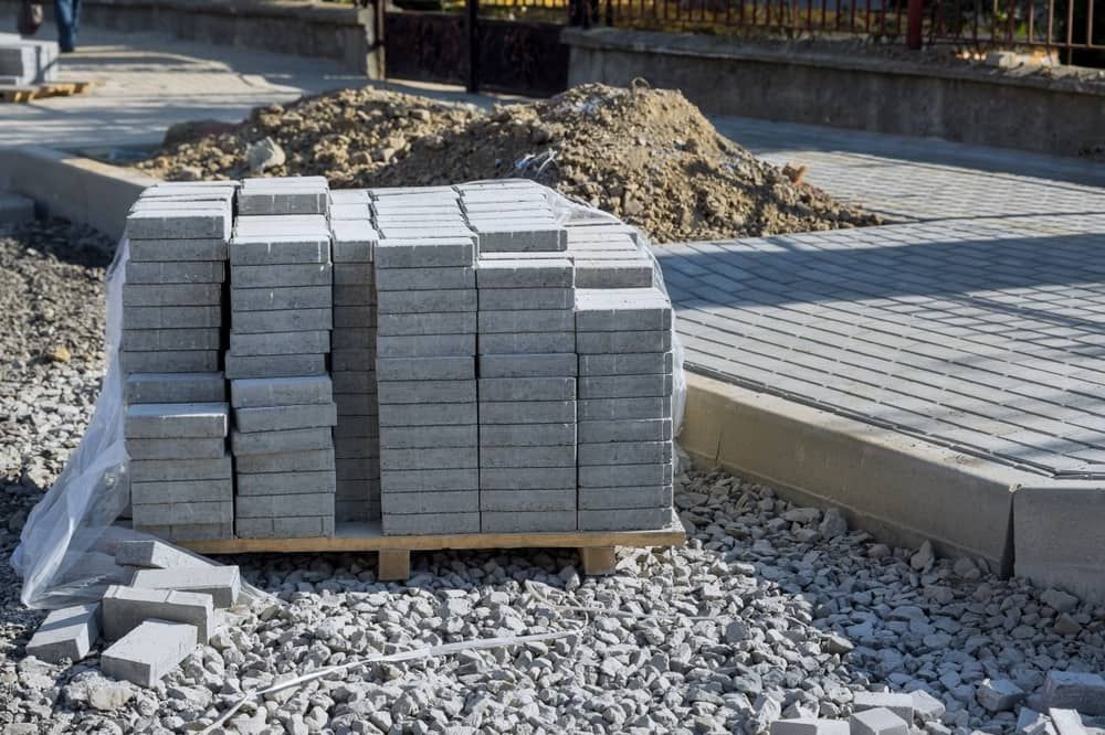 A Pallet Of Bricks Is Sitting On Top Of A Pile Of Gravel — Mascrete Pty Ltd In Hermit Park, QLD