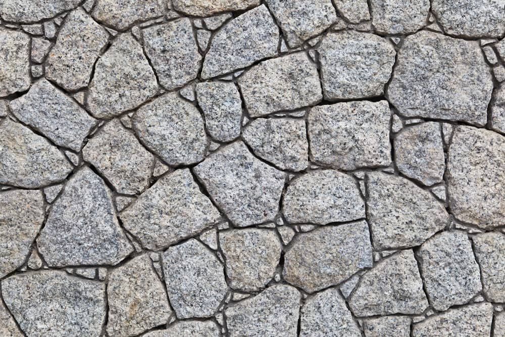 A Close Up Of A Stone Wall Made Of Large Rocks — Mascrete Pty Ltd In Hermit Park, QLD