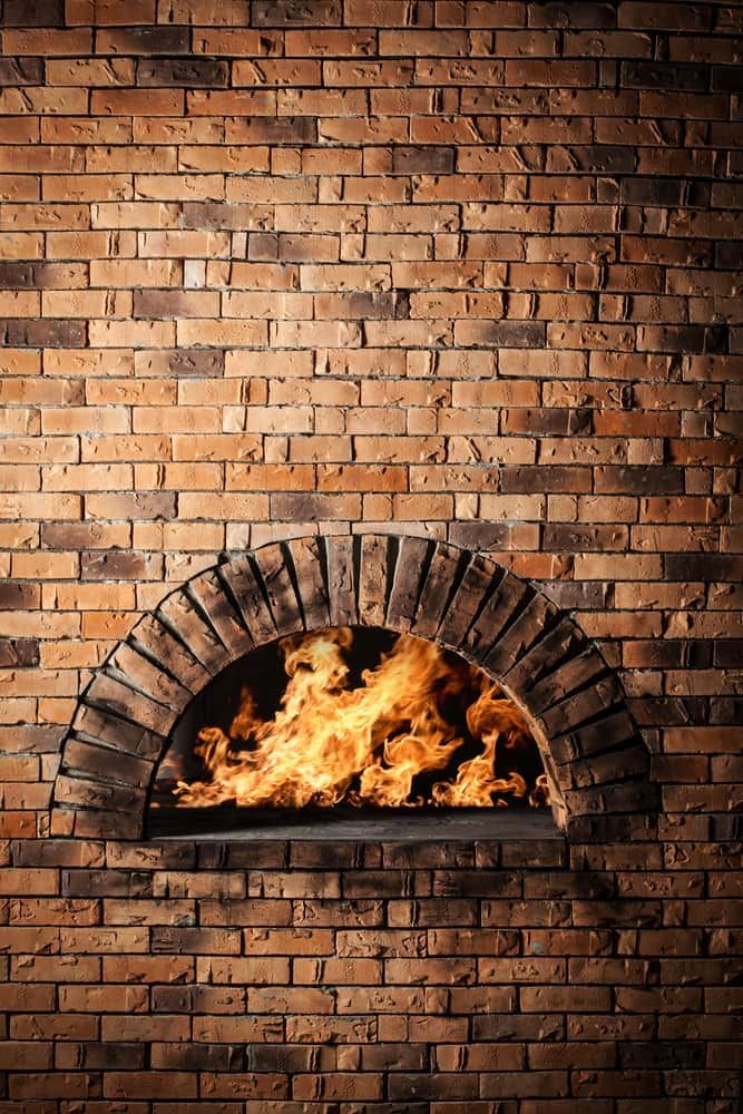 A Brick Oven With Flames Coming Out Of It — Mascrete Pty Ltd In Hermit Park, QLD
