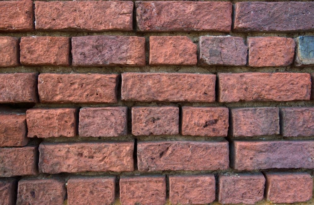 A Close Up Of A Red Brick Wall — Mascrete Pty Ltd In Hermit Park, QLD