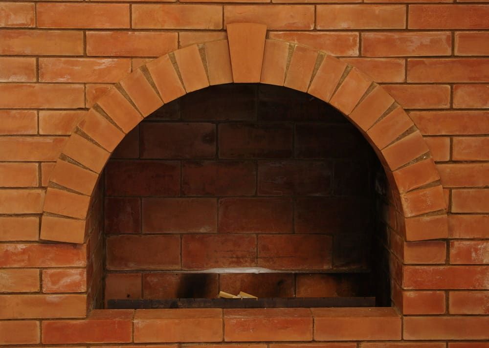 A Brick Wall With A Hole In The Middle Of It — Mascrete Pty Ltd In Hermit Park, QLD