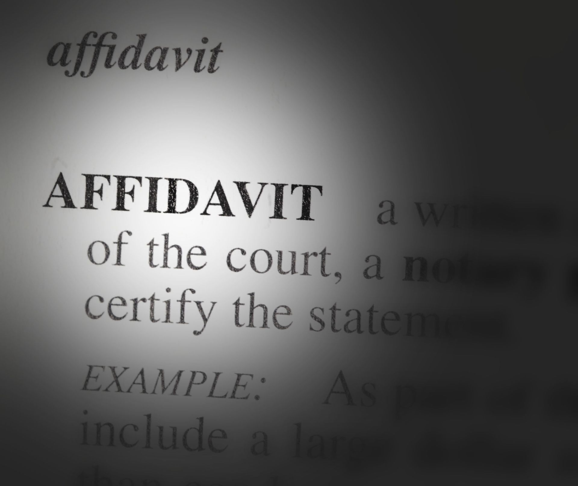 Close-up of the word “AFFIDAVIT” on a page, with blurred text in the background.