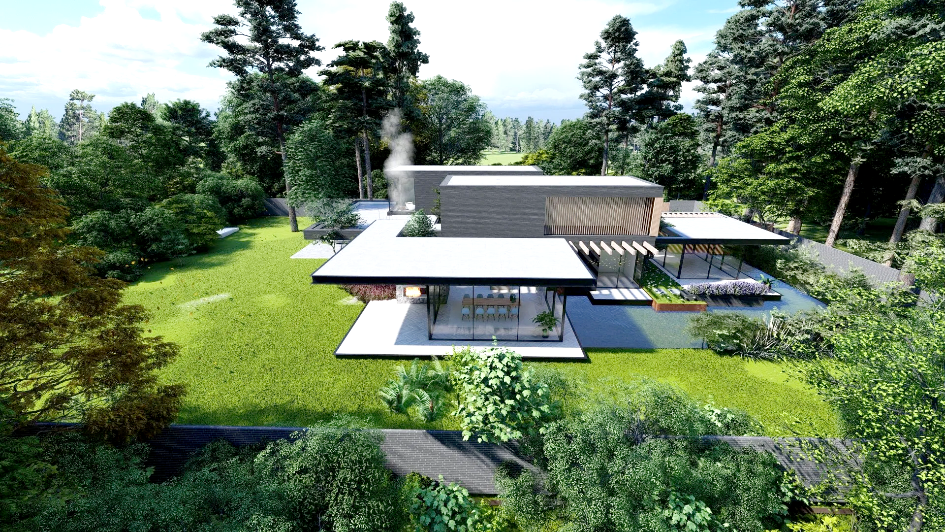 Een luchtfoto van een modern huis midden in een bos.