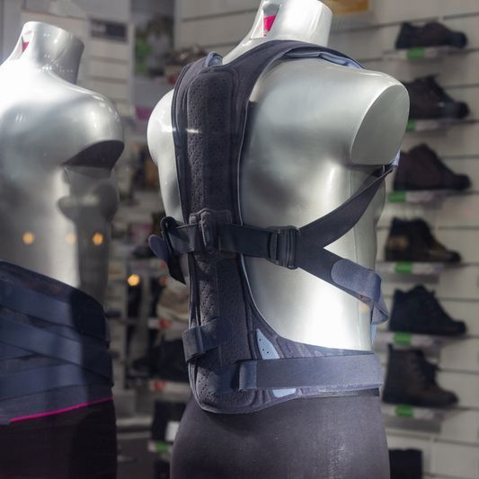 A mannequin is wearing a backpack in a store