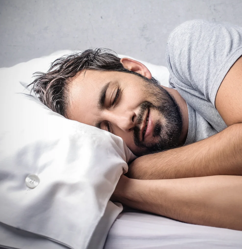 Man sleeping peacefully in bed