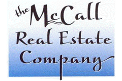 A yellow and green logo for real estate and realtor
