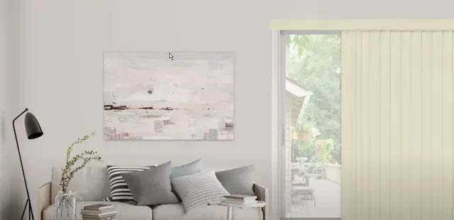 Minimalist living room with gray sofa, floor lamp, wall art, and sliding glass door with blinds
