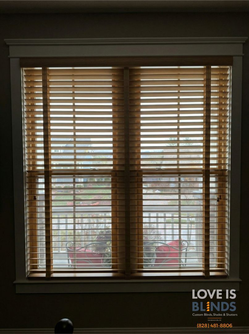 Window with closed wooden blinds letting in daylight; 