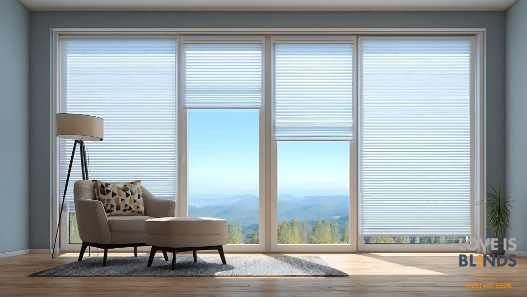 Bright living room with a chaise lounge, floor lamp, and large windows with blinds overlooking a distant view